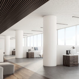 Side view of an open office interior with a bar table, laptops standing on it, dark wooden ceiling and floor and a wall with sticky notes. 3d rendering